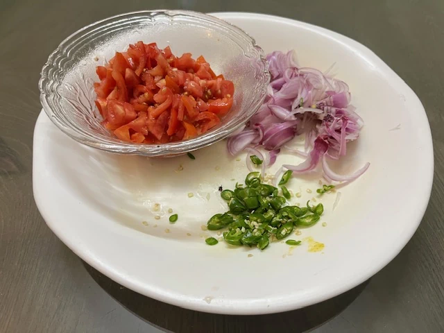 Chopped tomatoes, onions and green chilies