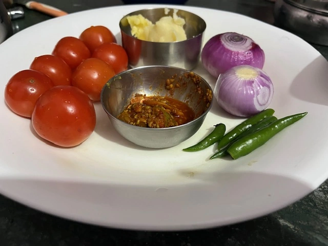 Cooking ingredients, pickle, ghee, green chilies, tomatoes, onions 