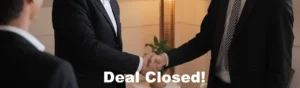 Handshake to celebrate a successful deal closure.