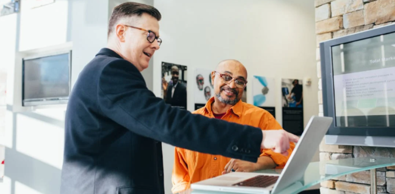 Salesperson giving sales presentation to prospective customer