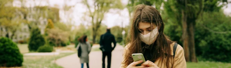 Girl with viral flu with mask on her face
