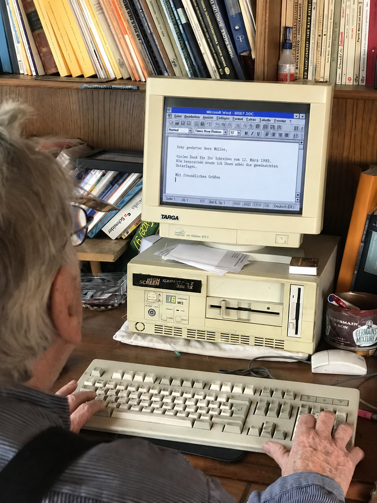 From Words Lost in the Air to Words Written by AI 6 Person using an early personal computer and word processor to write and edit text digitally